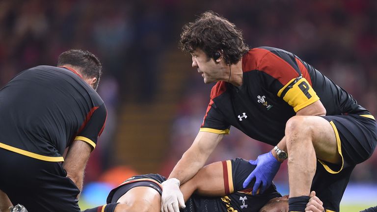 Wales' Rhys Webb lies on the ground injured during the World Cup warm up match v Italy