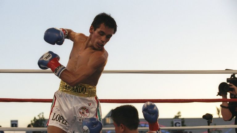 29 Jun 1996: Ricardo Lopez stands over Kitichai Preecha after knocking him down during their bout at the Fantasy Springs Casino in Indio, California. Lopez