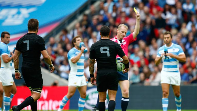 Wayne Barnes shows Richie McCaw a yellow card during the Pool C match between New Zealand and Argentina at Wembley Stadium