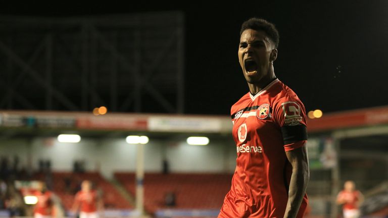 Walsall's Rico Henry celebrates scoring his side's second goal of the game during the Capital One Cup, second round match at the Banks's Stadium, Walsall.