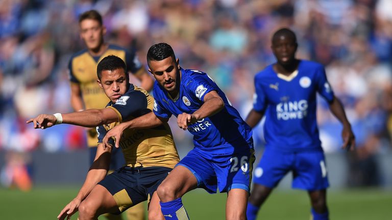 Riyad Mahrez of Leicester City and Alexis Sanchez of Arsenal compete for the ball 
