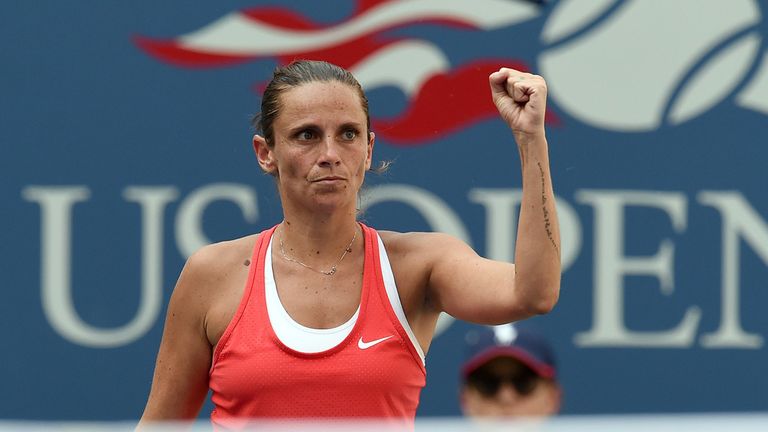 Roberta Vinci of Italy reacts to winning a point against Kristina Mladenovic of France during their 2015 US Open Women's singles quaterfinals