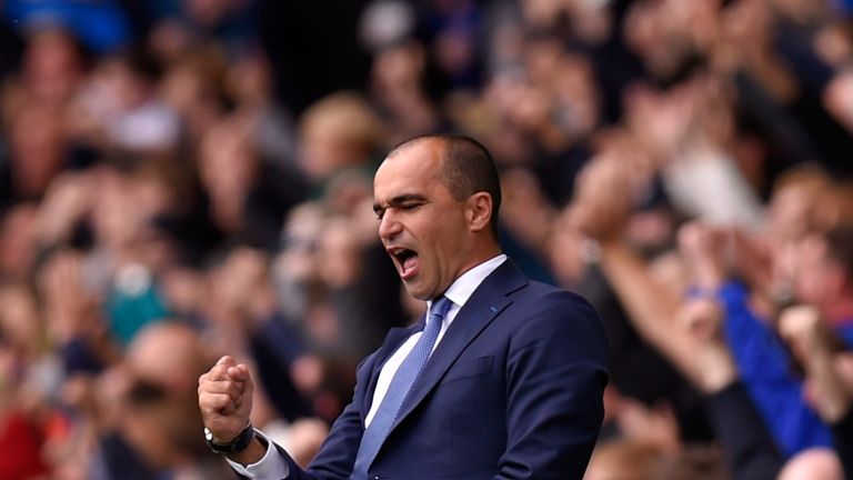 Roberto Martinez, manager of Everton celebrates the opening goal scored by Steven Naismith against Chelsea