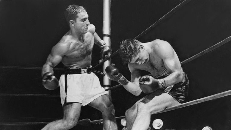 American boxer Rocky Marciano (1923 - 1969) batters Roland La Starza against the ropes in the 11th round of their heavyweight contest at the Polo Grounds, 