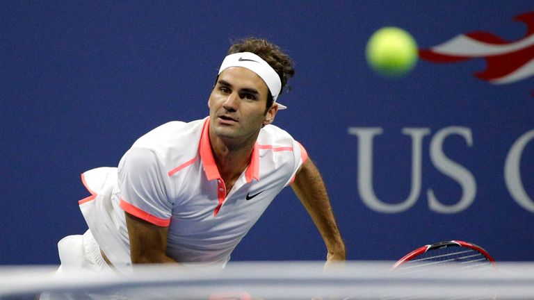 Roger Federer serves to Novak Djokovic
