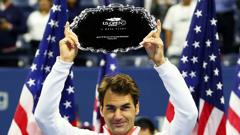  Roger Federer of Switzerland, right, reacts with his trophy after being defeated Novak Djokovic of Serbia during their Men's 
