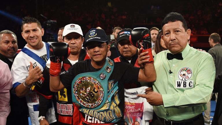 Boxer Roman Gonzalez of Nicaragua (C) celebrates after defeating Edgar Sosa of Mexico