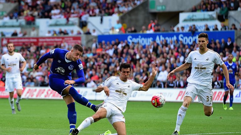 Ross Barkley of Everton shoots at goal while Jack Cork of Swansea City tries to block