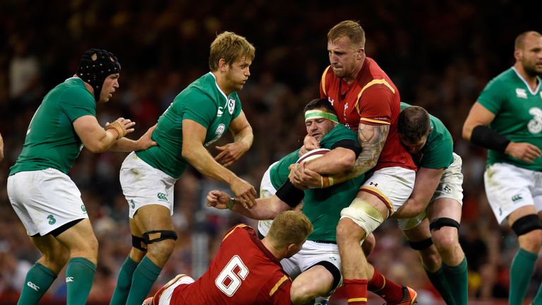 Ross Moriarty of Wales  (right) tackles Ireland's Fergus McFadden during the World Cup warm up match at the Millennium Stadium on August 8, 2015.