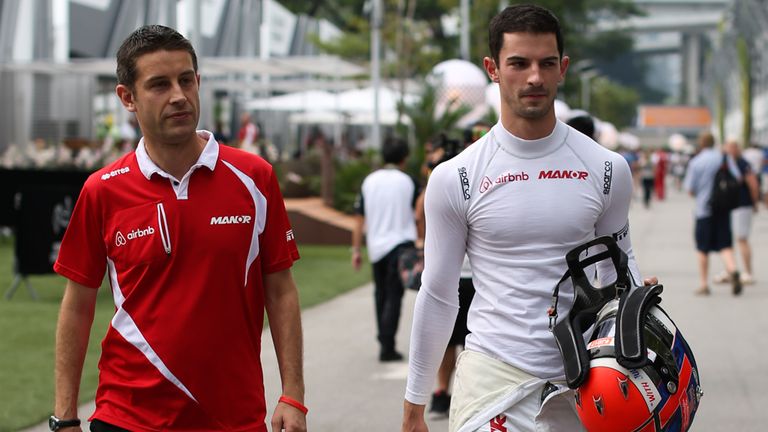 Alexander Rossi (right) arrives in the Singapore paddock