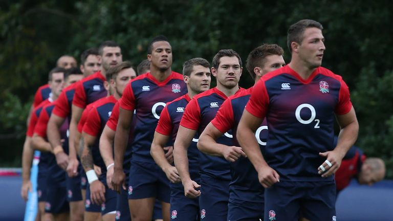 The England backs line up during a training session