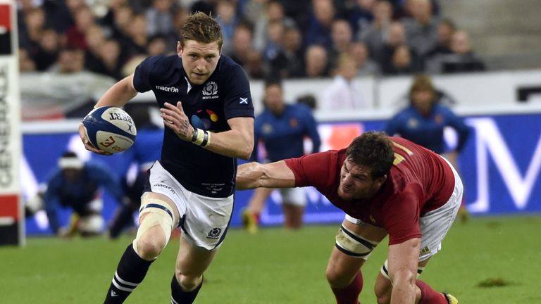 Scotland fly-half Finn Russell evades France's Alexandre Flanquart