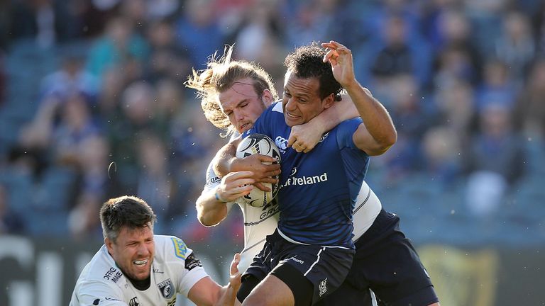 Leinster full-back Isa Nacewa is tackled by Kristian Dacey