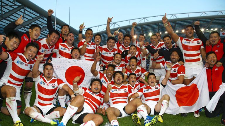 Japan players celebrate after their win over South Africa