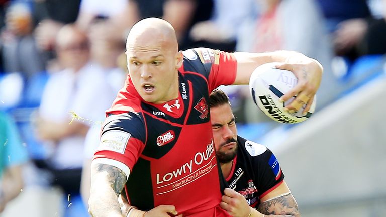 Salford's Cory Paterson is tackled by Leigh's Mathias Pala