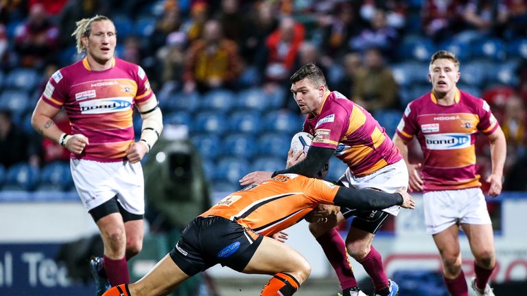 Huddersfield's Danny Brough is tackled by Castleford's Ben Roberts - March 2015