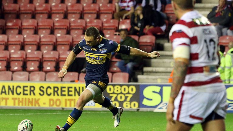 Leeds' Kevin Sinfield kicks the winning penalty against Wigan in the 2012 play-offs