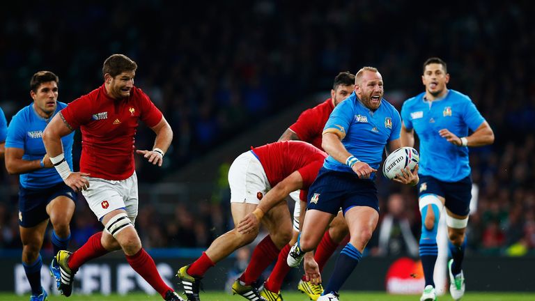 Italy hooker Leonardo Ghiraldini makes a break during their Rugby World Cup defeat to France