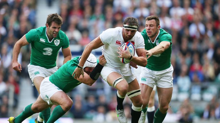 England flanker Tom Wood is tackled by Rory Best (left) and Tommy Bowe