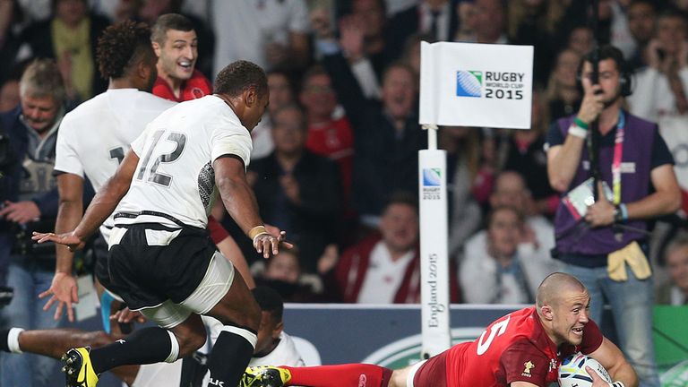 England's Mike Brown scores his sides second try during the Rugby World Cup match at Twickenham Stadium, London.