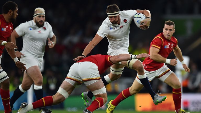 England's flanker Tom Wood (2nd R) runs with the ball  during a Pool A match of the 2015 Rugby World 