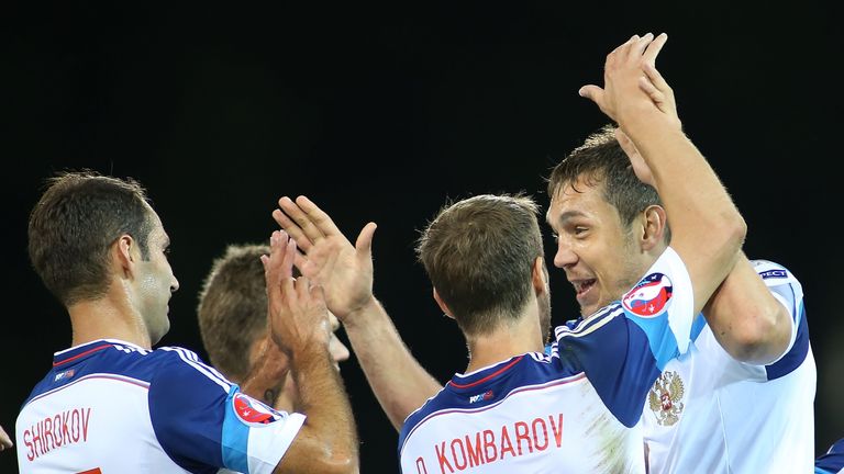 Russia's Artem Dzyuba (R) celebrates with Dmitri Kombarov (C) and Roman Shirokov after scoring during the European Qualifier v Liechtenstein in Vaduz
