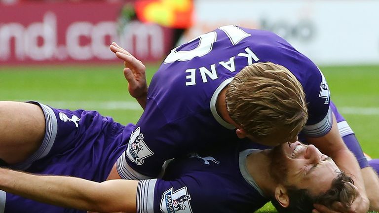 Harry Kane celebrates with Ryan Mason, as he lies injured after scoring the only goal in the match between Sunderland and Tottenham Hotspur