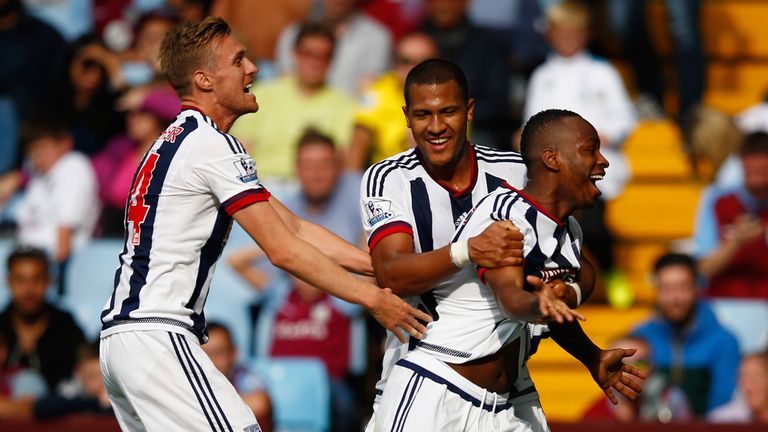 Saido Berahino celebrates scoring his team's first goal with Darren Fletcher and Salomon Rondon