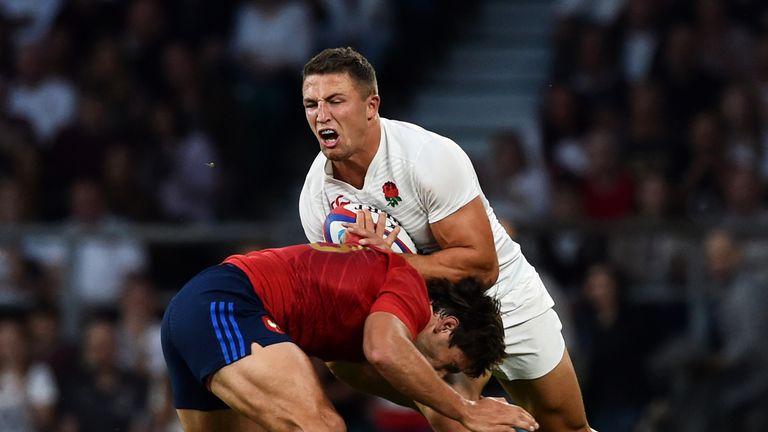 Sam Burgess of England is tackled by Remi Lamerat of France 