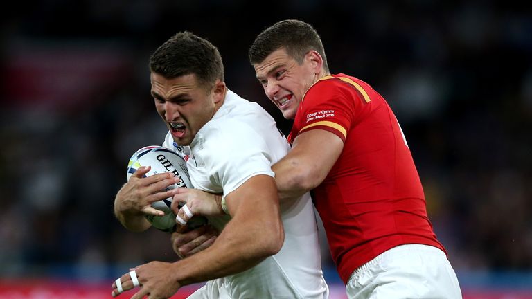 Sam Burgess of England is tackled by Scott Williams of Wales during the 2015 Rugby World Cup Pool A match at Twickenham