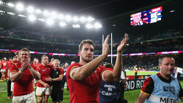 Sam Warburton applauds the fans as he walks off the pitch after beating England