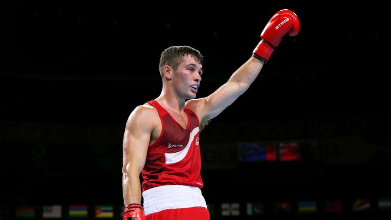 GLASGOW, SCOTLAND - AUGUST 02:  Scott Fitzgerald of England celebrates winning the gold medal against Mandeep Jangra of India in the Men's Welter (69kg) Fi