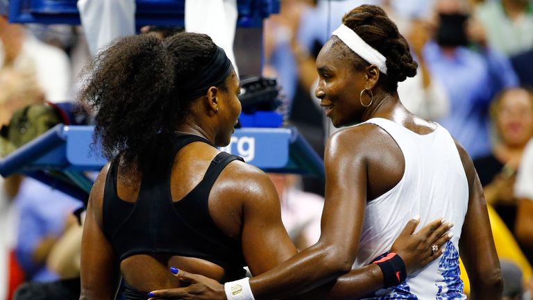 Serena Williams (L) hugs Venus Williams