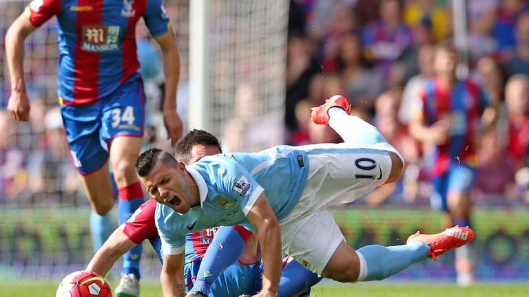 Scott Dann of Crystal Palace fouls Manchester City'€™s Sergio Aguero.