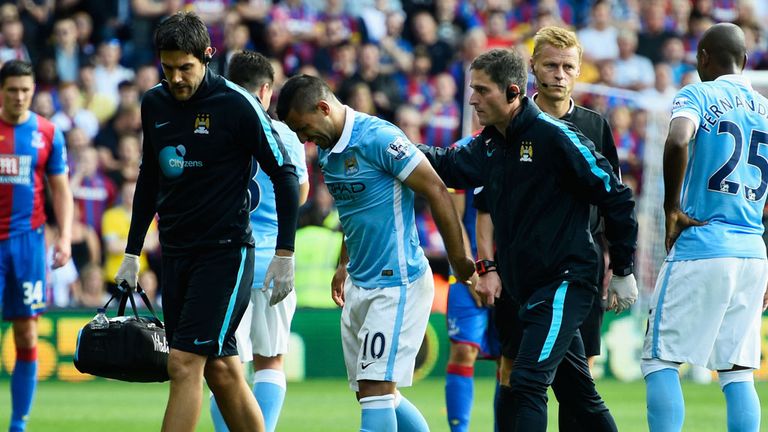 Sergio Aguero limps off the pitch after picking up an injury