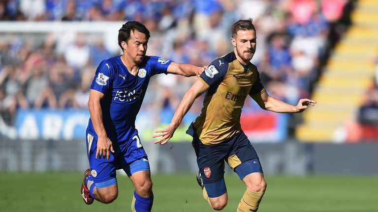 Leicester's Shinji Okazaki and Aaron Ramsey of Arsenal compete for the ball