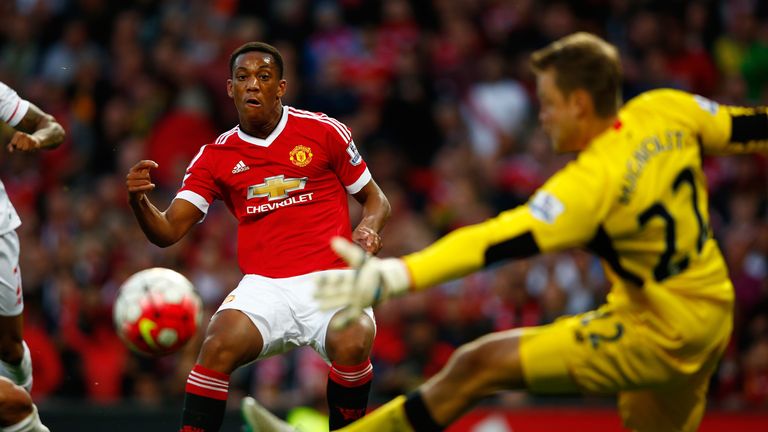 MANCHESTER, ENGLAND - SEPTEMBER 12:  Anthony Martial of Manchester United scores past Simon Mignolet of Liverpool for his team's third goal