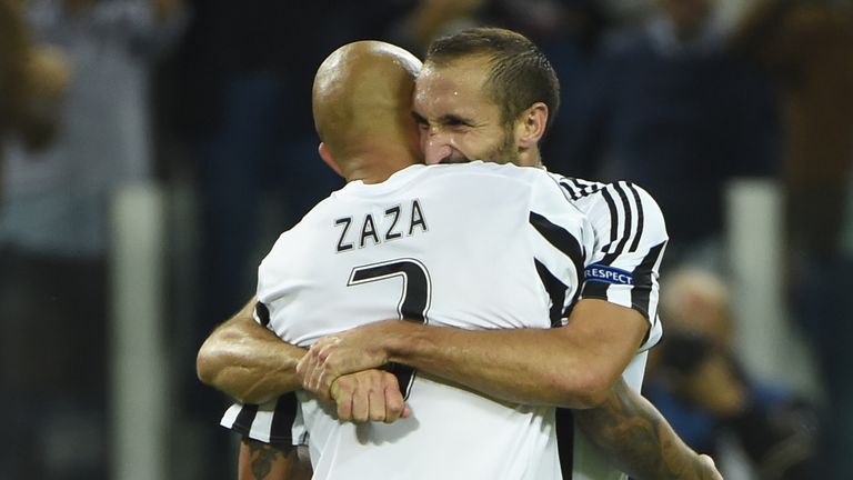 Juventus striker Simone Zaza celebrates with Giorgio Chiellini after scoring against Sevilla