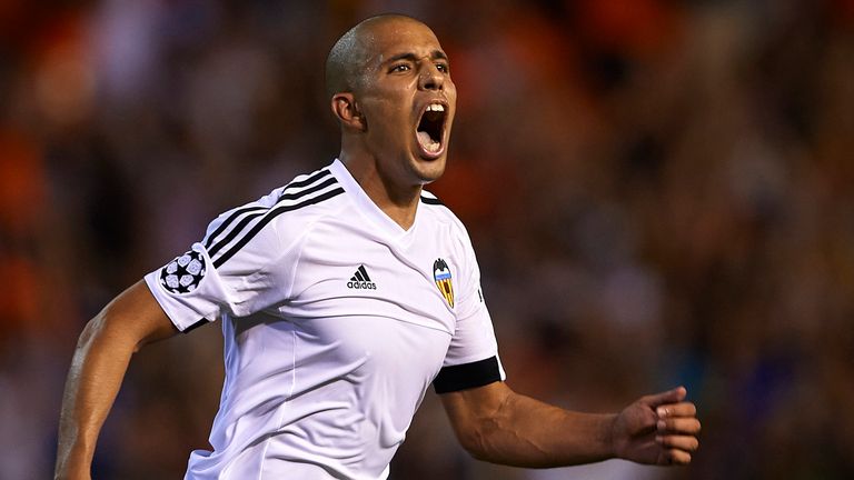 VALENCIA, SPAIN - AUGUST 19:  Sofiane Feghouli of Valencia celebrates scoring his team's third goal during the UEFA Champions League Qualifying Round Play 