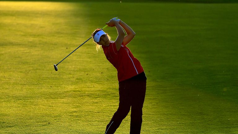 Alison Lee plays her shot on 16 as the light runs out on Day 1 of the Solheim Cup