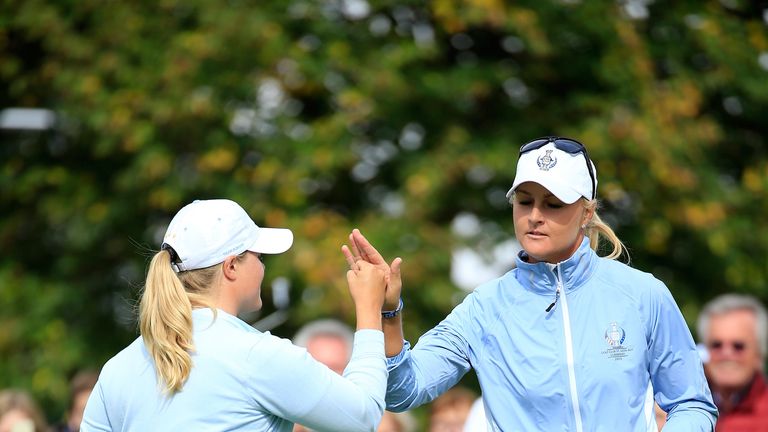Anna Nordqvist holes a birdie putt on the eighth hole to take Europe 2 up.