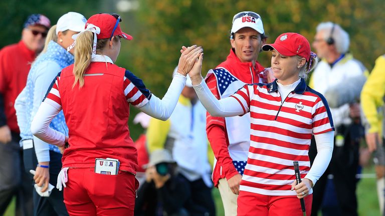 Morgan Pressel (R) of the United States Team celebrates a birdy at the first green during the morning foursomes on day one of the Solheim Cup 2015