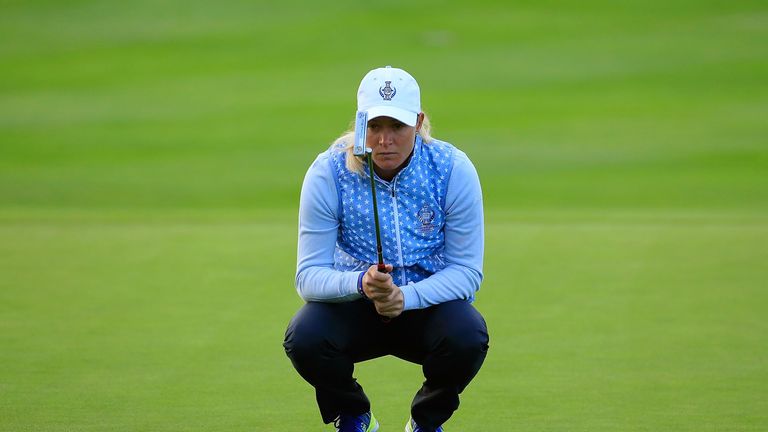  Suzann Pettersen of the European Team lines a put at first green during the morning foursomes on day one of the Solheim Cup.