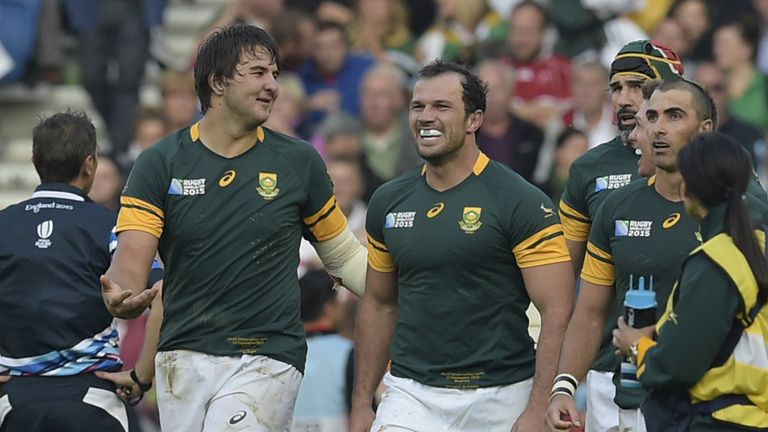 South Africa's lock Lood de Jager (L) celebrates after scoring a try