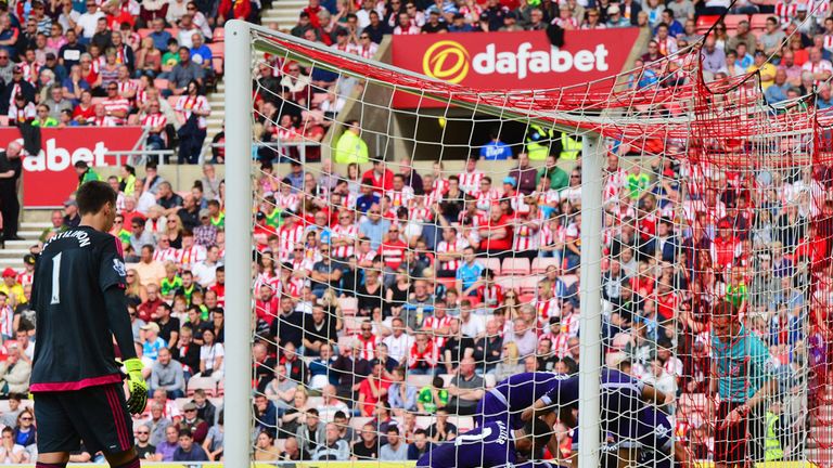 Tottenham players mob Ryan Mason after his winner at Sunderland