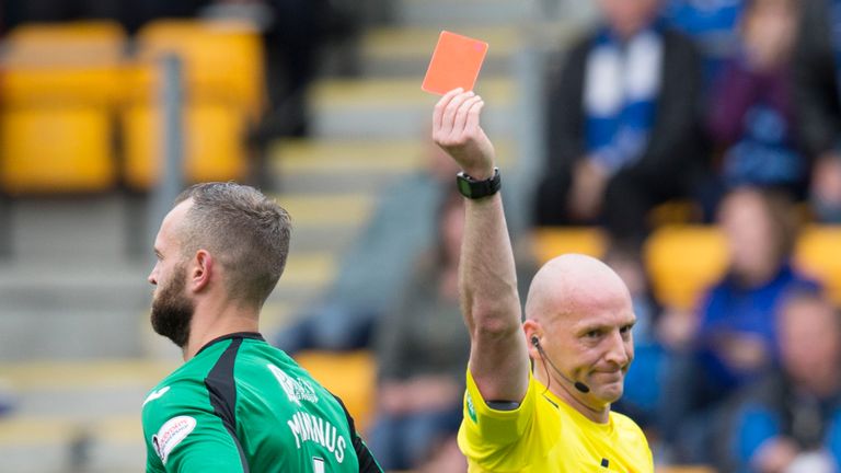 St Johnstone's Alan Mannus is shown the red card after bringing down Billy McKay