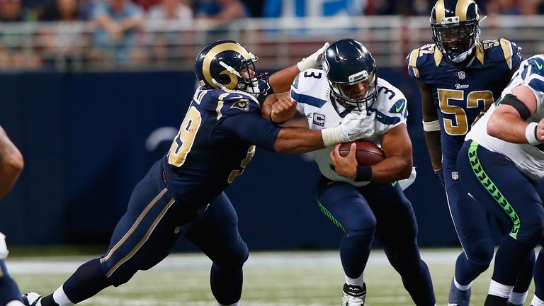  Aaron Donald #99 of the St. Louis Rams sacks Russell Wilson #3 of the Seattle Seahawks in overtime to win the game 34-31 at t