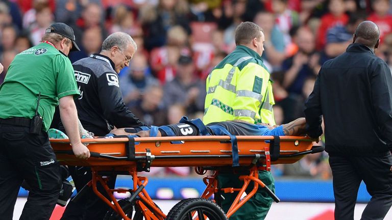 Callum Wilson leaves the field on a stretcher