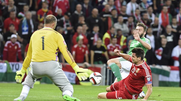 Northern Ireland's striker Stuart Dallas (R) has his shot saved by Hungary's goalkeeper Gabor Kiraly 