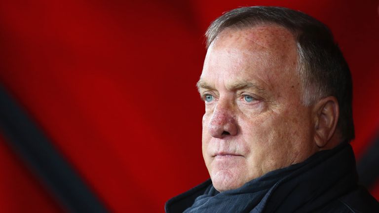 Dick Advocaat manager of Sunderland looks on as Man City score four early goals.